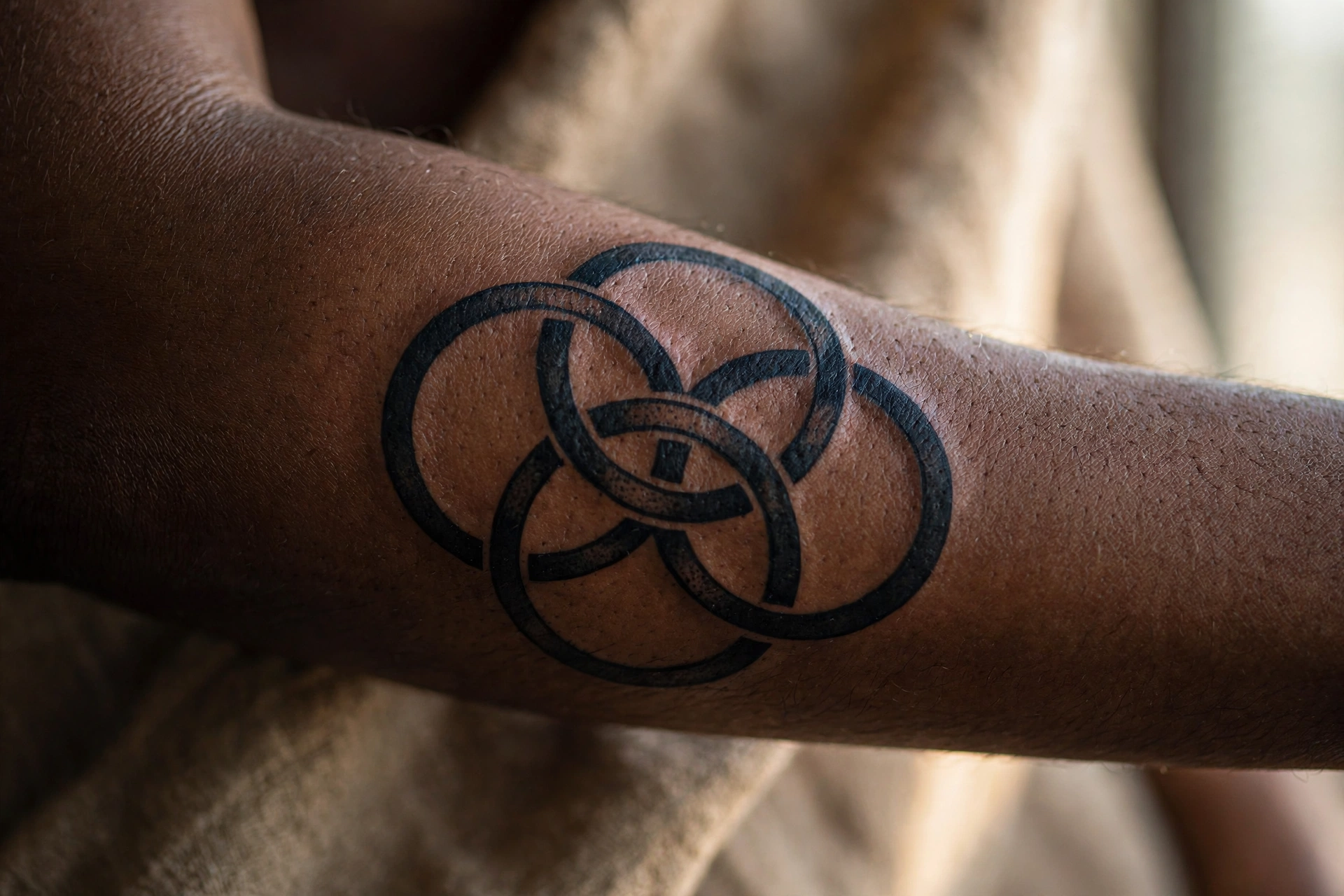 Interlocking circles tattoo representing each family member