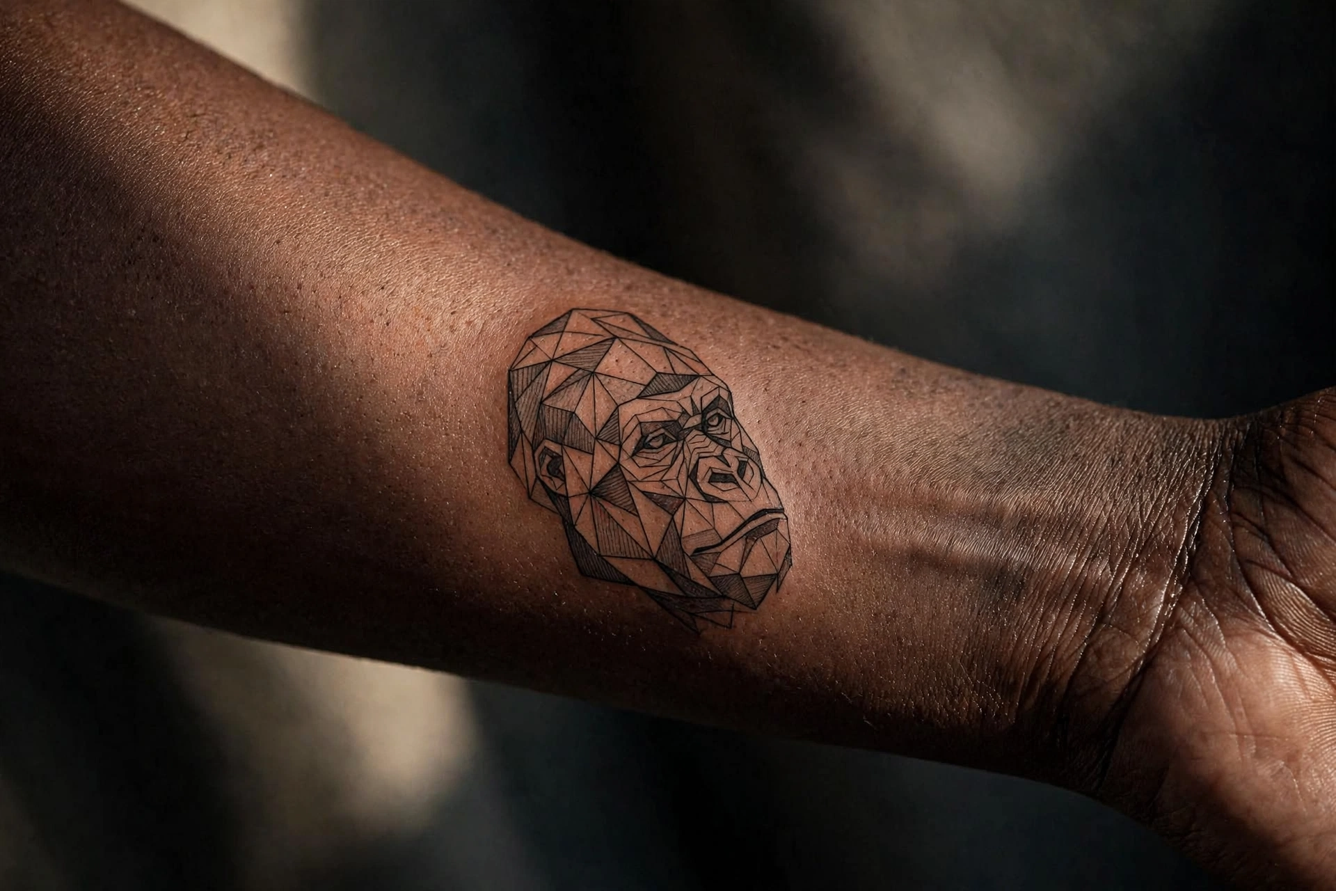 Low poly gorilla tattoo on man's chest