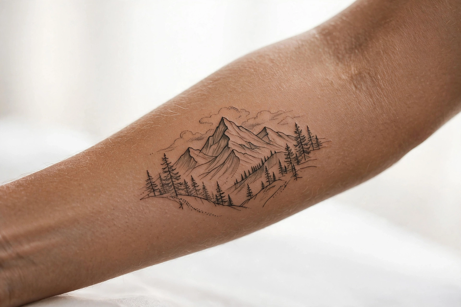 Mountain landscape memorial tattoo at sunrise