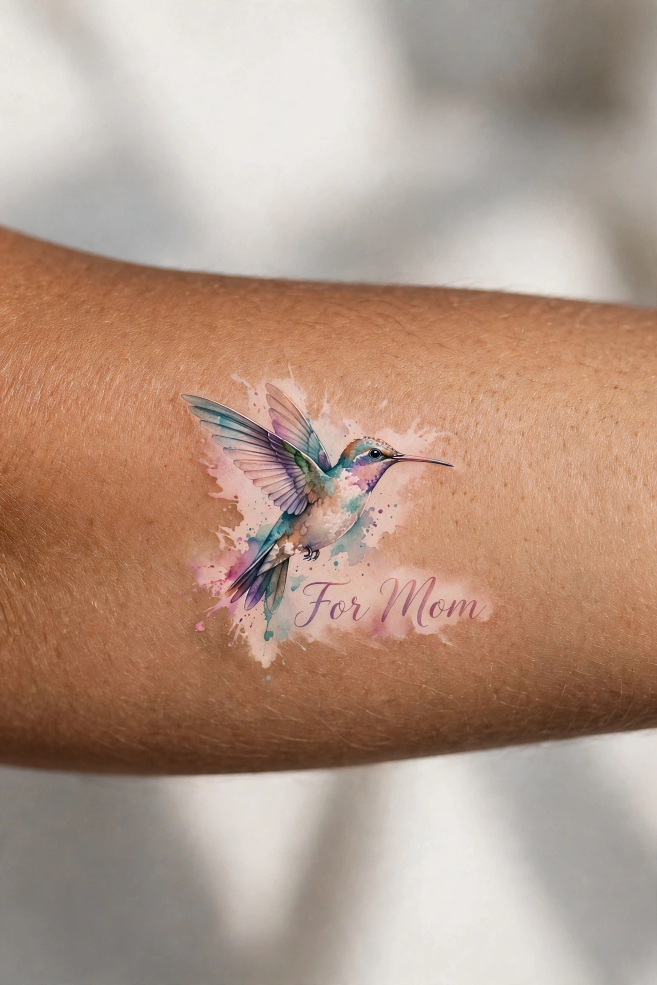 Hummingbird tattoo for mom, joy and resilience symbolism