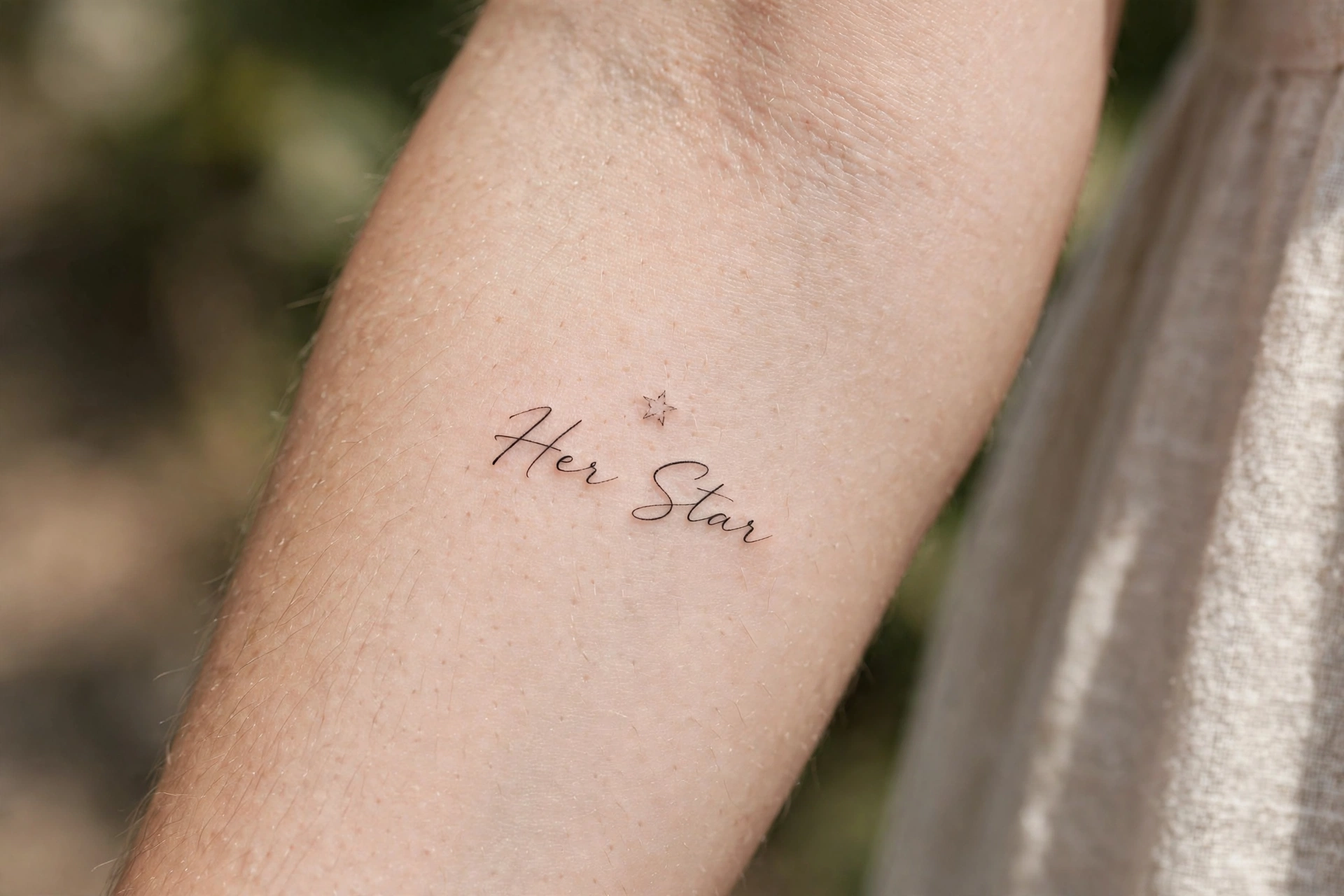 Single bright star tattoo dedicated to mom