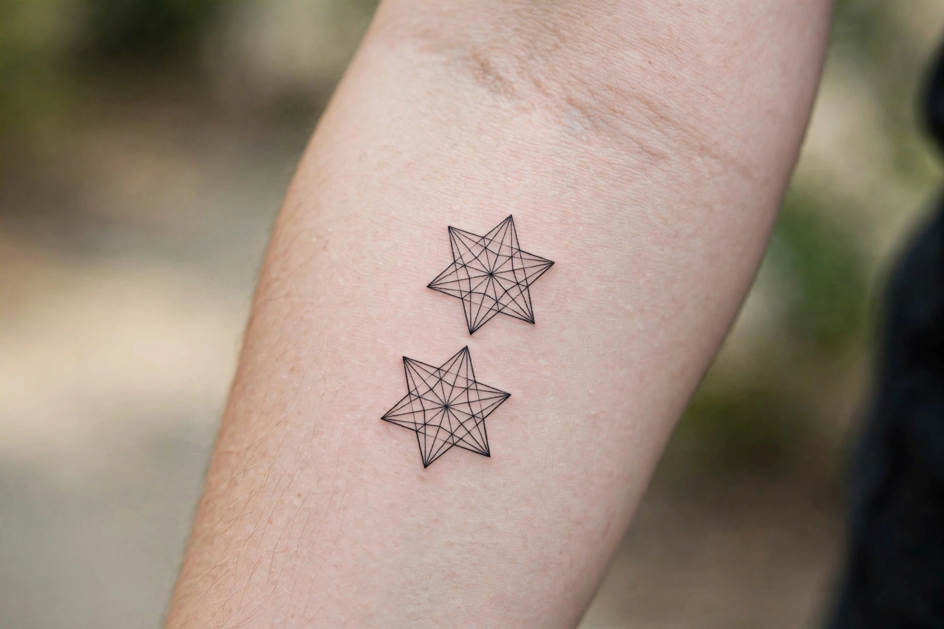 Matching guiding star tattoos for mother and son