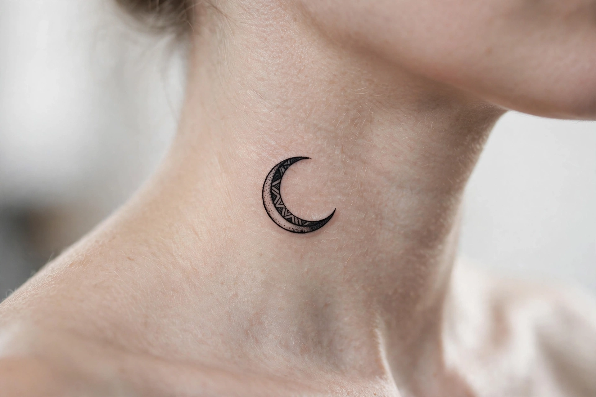 Trail of tiny stars tattoo cascading down a woman's nape