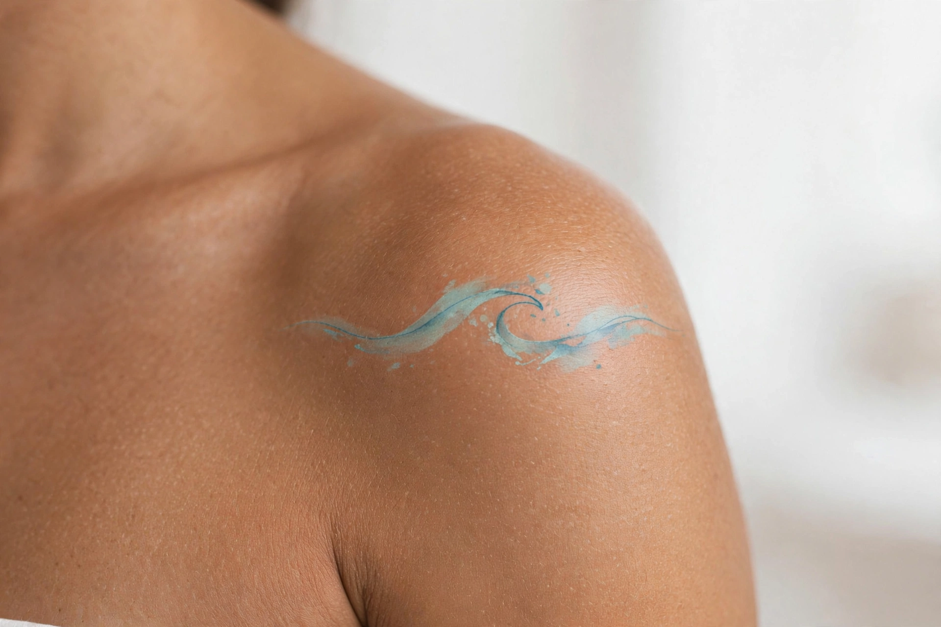 Single continuous wave line tattoo in minimalist style