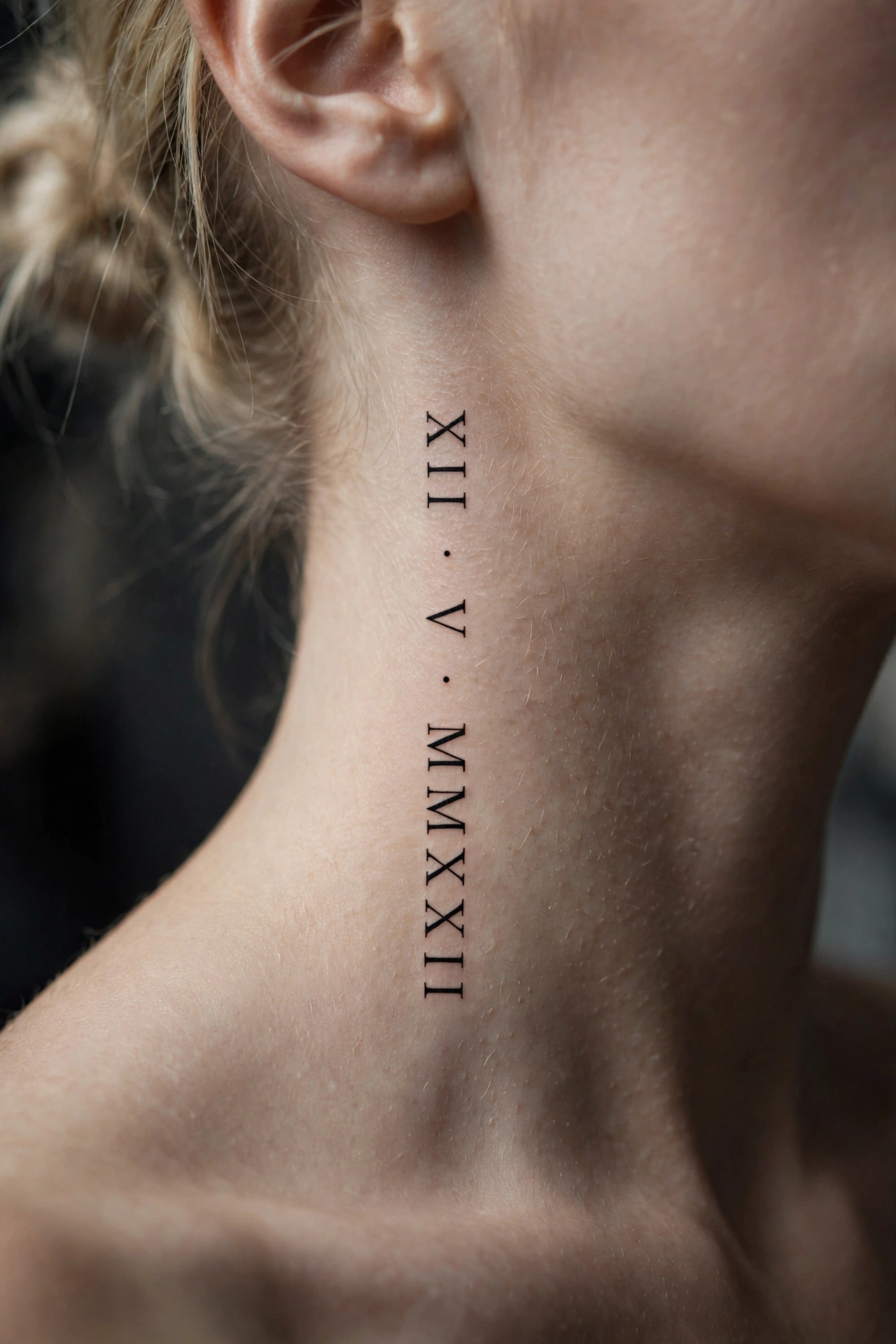 Roman numeral date tattoo running vertically on the side of a neck
